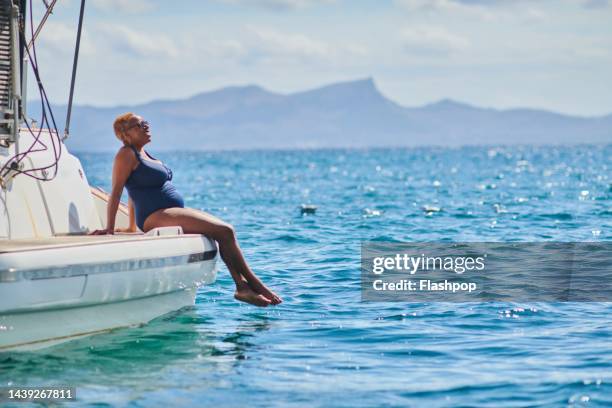 woman relaxing on a boat - hot spanish women ストックフォトと画像