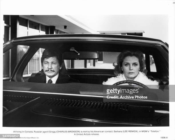 Arriving in Canada, Russian agent Charles Bronson is met by his American contact Lee Remick in a scene from the film 'Telefon', 1977.