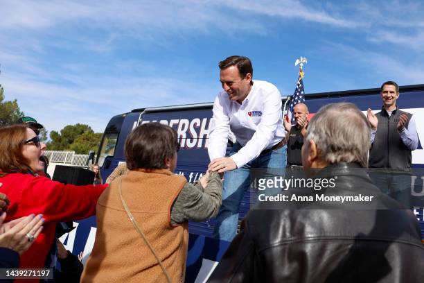 Nevada Republican U.S. Senate nominee Adam Laxalt shakes hands with supporters after speaking at a campaign event on November 05, 2022 in Las Vegas,...