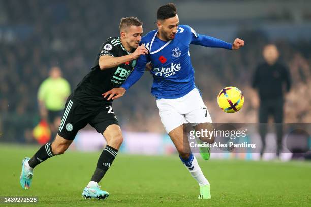 Dwight McNeil of Everton is challenged by Timothy Castagne of Leicester City during the Premier League match between Everton FC and Leicester City at...