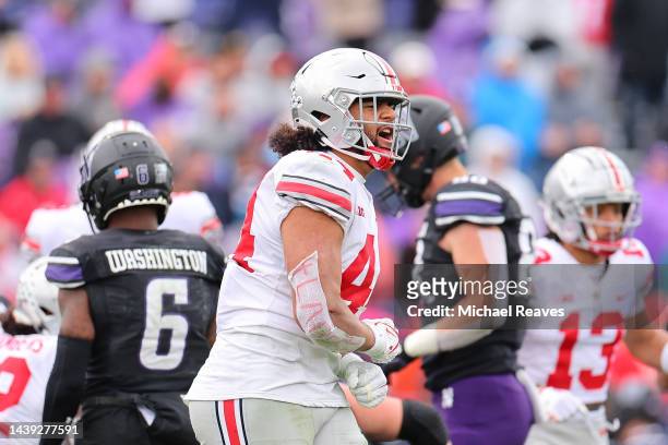 Tuimoloau of the Ohio State Buckeyes celebrates a third down stop against the Northwestern Wildcats during the second half at Ryan Field on November...