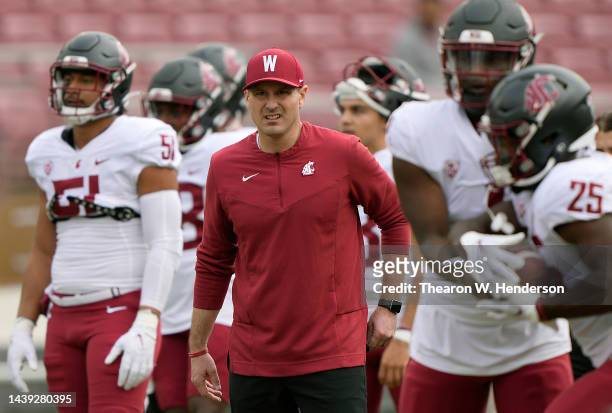 Head coach Jake Dickert of the Washington State Cougars looks on while his team warms up during pregame warm ups prior to playing the Stanford...