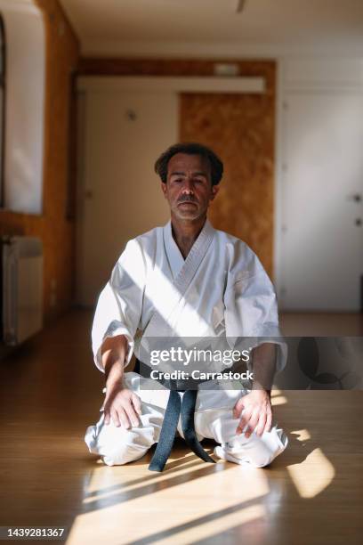 close shot of karate man in greeting ritual - judo stock pictures, royalty-free photos & images