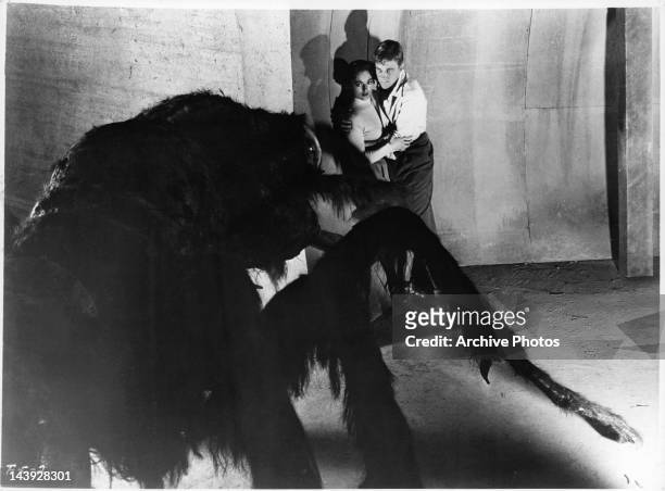Mara Corday is held by John Agar in a scene from the film 'Tarantula', 1954.