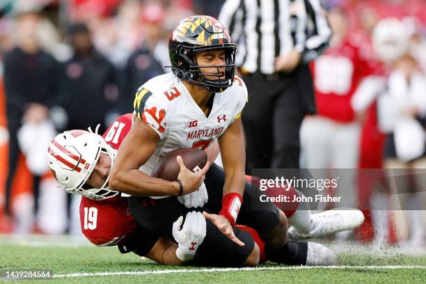 Taulia Tagovailoa of the Maryland Terrapins is sacked by Nick Herbig of the Wisconsin Badgers in the third quarter at Camp Randall Stadium on...