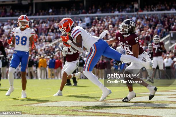 Caleb Douglas of the Florida Gators catches a touchdown pass in the second half while defended by Marquis Groves-Killebrew of the Texas A&M Aggies at...