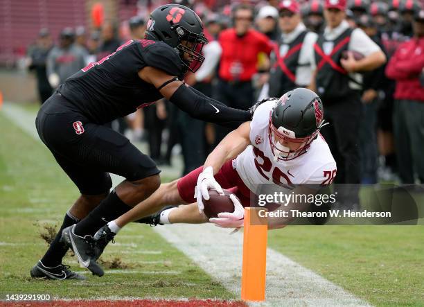 Anderson Grover of the Washington State Cougars dives for the end zone scoring a touchdown before he's pushed out of bound by Patrick Fields of the...