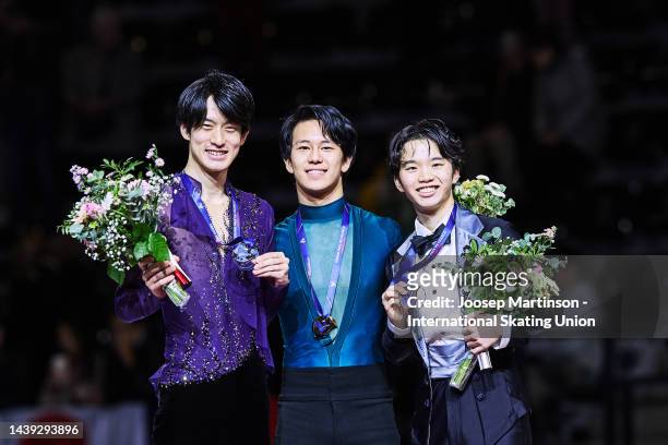 Sota Yamamoto of Japan, Adam Siao Him Fa of France and Kazuki Tomono of Japan pose in the Men's medal ceremony during the ISU Grand Prix of Figure...