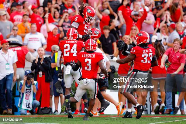 Kelee Ringo of the Georgia Bulldogs celebrates his interception with teammates during the second quarter against the Tennessee Volunteers at Sanford...