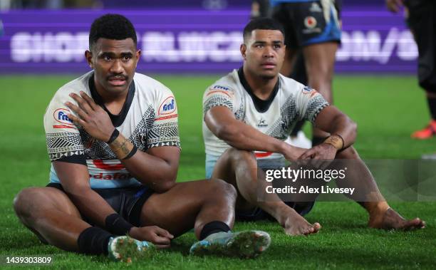 Penioni Tagituimua and Vuate Karawalevu of Fiji cut a dejected figure following the Rugby League World Cup Quarter Final match between New Zealand...