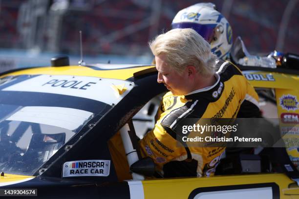 Brennan Poole, driver of the Out of The Groove Chevrolet, enters his car during qualifying for the NASCAR Xfinity Series Championship at Phoenix...