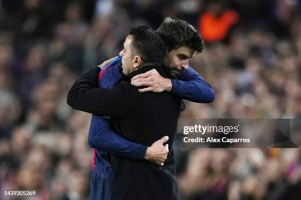 Gerard Pique of FC Barcelona embraces Xavi, Head Coach of FC Barcelona after being substituted during the LaLiga Santander match between FC Barcelona...