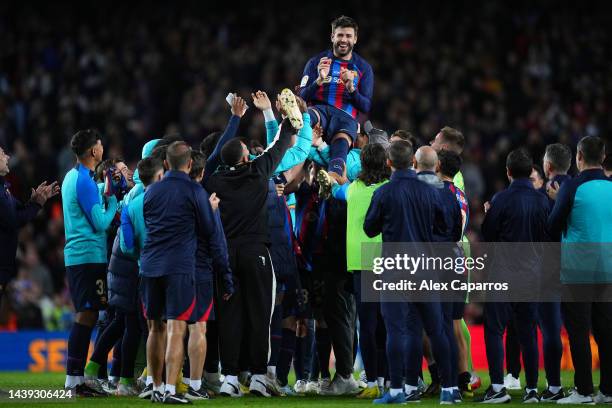 Gerard Pique of FC Barcelona is thrown into the air by their team mates after the LaLiga Santander match between FC Barcelona and UD Almeria at...