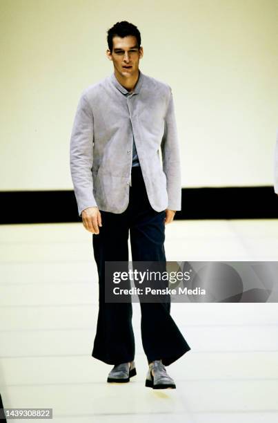 Combined Armani men's fashion show featuring three different brands - Giorgio Armani, Emporio Armani, and Armani Jeans.
