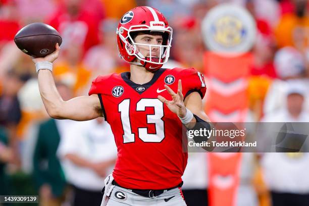 Stetson Bennett of the Georgia Bulldogs throws a pass against the Tennessee Volunteers during the third quarter at Sanford Stadium on November 05,...