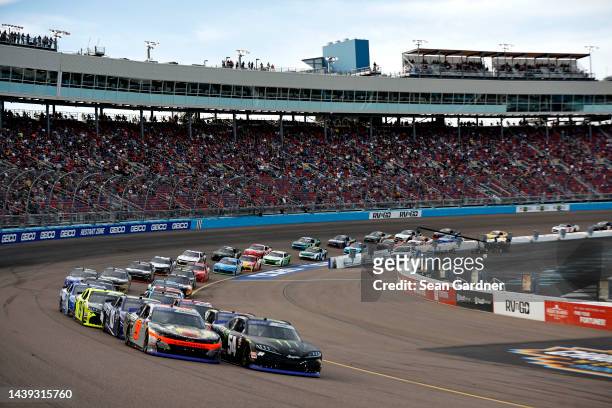 Noah Gragson, driver of the Bass Pro Shops/TrueTimber/BRCC Chevrolet, and Ty Gibbs, driver of the Monster Energy Toyota, race during the NASCAR...