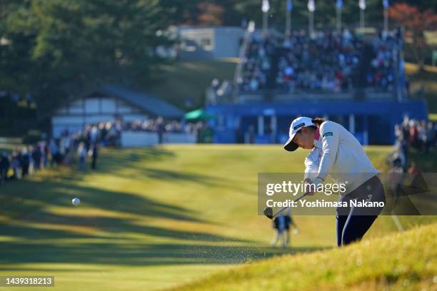 Mao Saigo of Japan hits her second shot on the 1st hole during the final round of the TOTO Japan Classic at Seta Golf Course North Course on November...