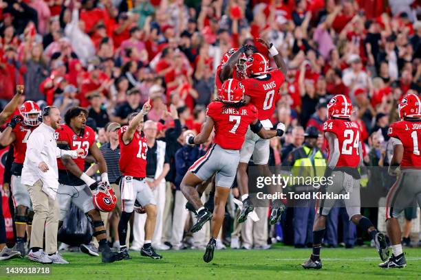 Rian Davis of the Georgia Bulldogs celebrates with teammates after a fourth down stop against the Tennessee Volunteers during the fourth quarter at...
