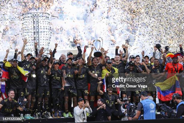 Carlos Vela of LAFC lifts the trophy to celebrate with his teammates after winning the MLS Cup Final match between Philadelphia Union and LAFC as...