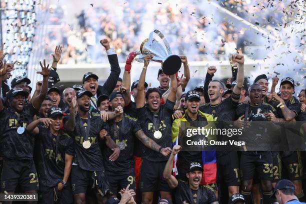 Carlos Vela of LAFC lifts the trophy to celebrate with his teammates after winning the MLS Cup Final match between Philadelphia Union and LAFC as...