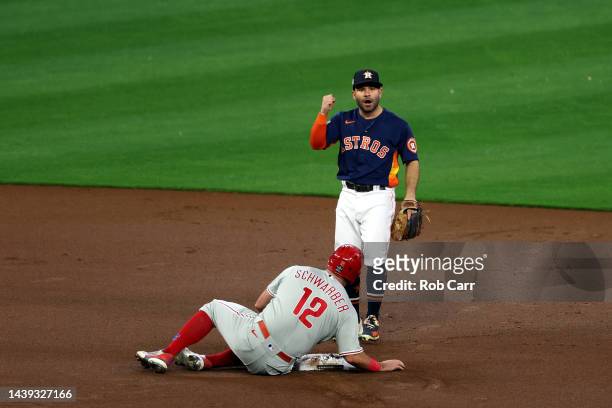 Jose Altuve of the Houston Astros reacts after making a double play against the Philadelphia Phillies during the first inning in Game Six of the 2022...