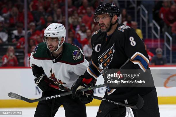 Alex Ovechkin of the Washington Capitals and Shayne Gostisbehere of the Arizona Coyotes battle for position during the second period at Capital One...