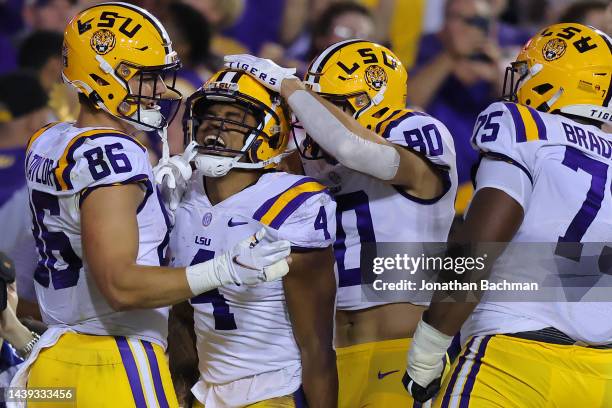 John Emery Jr. #4 of the LSU Tigers celebrates a touchdown during the first half against the Alabama Crimson Tide at Tiger Stadium on November 05,...