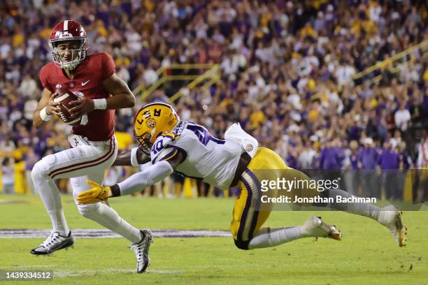 Bryce Young of the Alabama Crimson Tide is tackled by Harold Perkins Jr. #40 of the LSU Tigers during the first half at Tiger Stadium on November 05,...