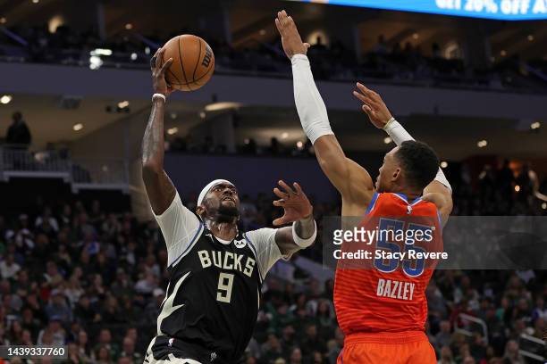 Bobby Portis of the Milwaukee Bucks drives to the basket against Darius Bazley of the Oklahoma City Thunder during the first half of a game at Fiserv...