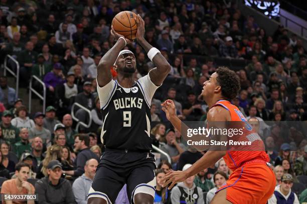 Bobby Portis of the Milwaukee Bucks shoots over Jeremiah Robinson-Earl of the Oklahoma City Thunder during the first half of a game at Fiserv Forum...