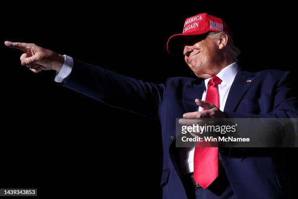Former U.S. President Donald Trump points to supporters after speaking at a rally at the Arnold Palmer Regional Airport November 5, 2022 in Latrobe,...
