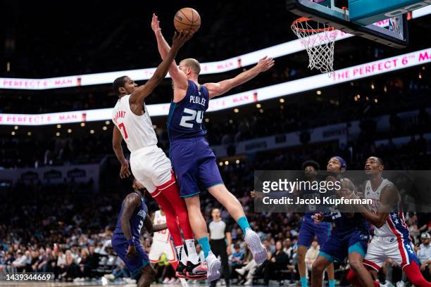 Kevin Durant of the Brooklyn Nets drives to the basket while guarded by Mason Plumlee of the Charlotte Hornets in the third quarter during their game...