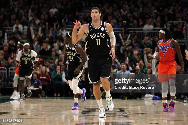 Brook Lopez of the Milwaukee Bucks reacts to a three point shot during the second half of a game against the Oklahoma City Thunder at Fiserv Forum on...