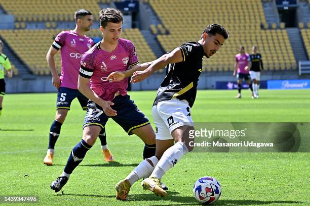 Daniel Arzani of Macarthur FC is tackled by Callan Elliot of the Phoenix during the round five A-League Men's match between Wellington Phoenix and...