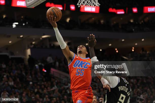 Darius Bazley of the Oklahoma City Thunder drives to the basket against Bobby Portis of the Milwaukee Bucks during the second half of a game at...