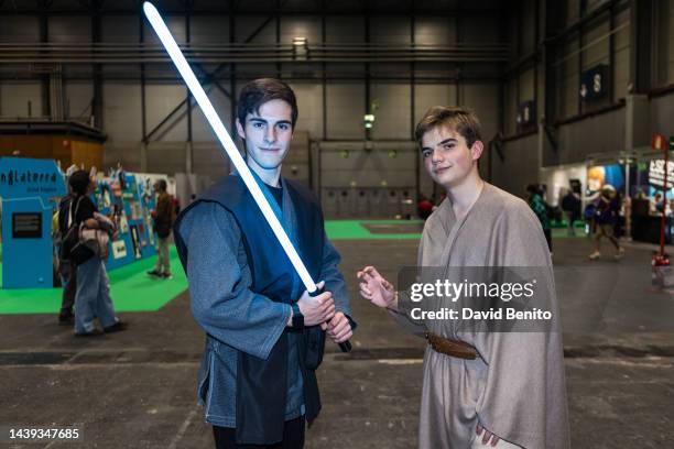 Visitor dressed as Star Wars with laser swords attends the Madrid Cómic Pop Up 2022 at Ifema on November 05, 2022 in Madrid, Spain.