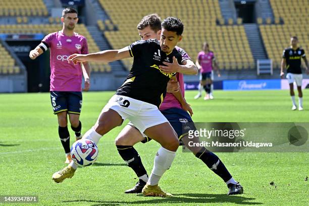 Daniel Arzani of Macarthur FC and Callan Elliot of the Phoenix compete for the ball during the round five A-League Men's match between Wellington...