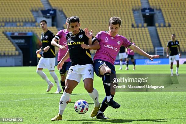 Daniel Arzani of Macarthur FC and Callan Elliot of the Phoenix compete for the ball during the round five A-League Men's match between Wellington...