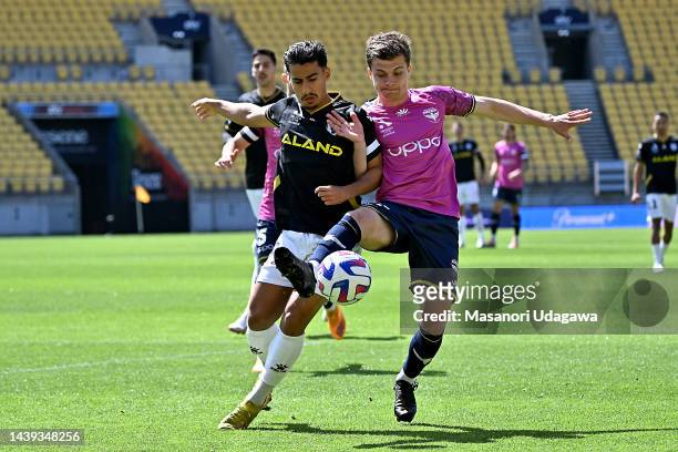 Callan Elliot of the Phoenix and Daniel Arzani of Macarthur FC compete for the ball during the round five A-League Men's match between Wellington...