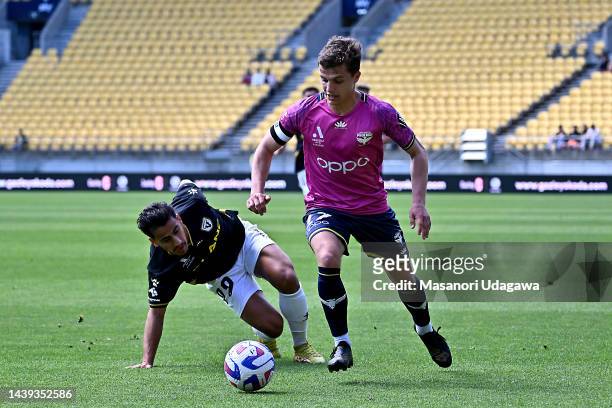 Callan Elliot of the Phoenix is tackled by Daniel Arzani of Macarthur FC during the round five A-League Men's match between Wellington Phoenix and...