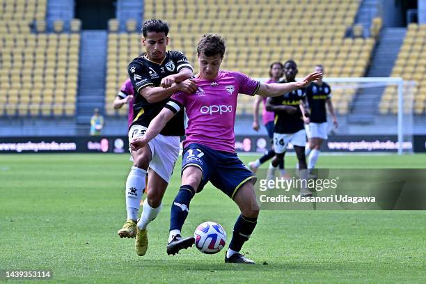 Callan Elliot of the Phoenix and Daniel Arzani of Macarthur FC compete for the ball during the round five A-League Men's match between Wellington...