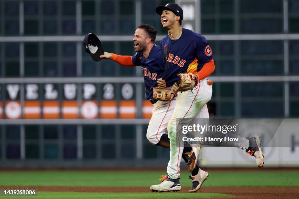 Jose Altuve and Jeremy Pena of the Houston Astros celebrate after defeating the Philadelphia Phillies 4-1 to win the 2022 World Series in Game Six of...