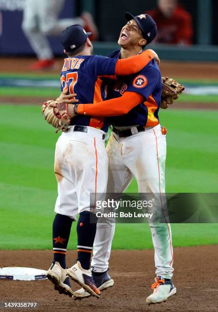 Jose Altuve and Jeremy Pena of the Houston Astros celebrate after defeating the Philadelphia Phillies 4-1 to win the 2022 World Series in Game Six of...