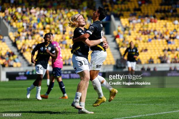 Lachlan Rose of Macarthur FC celebrates with Daniel Arzani after scoring a goal during the round five A-League Men's match between Wellington Phoenix...