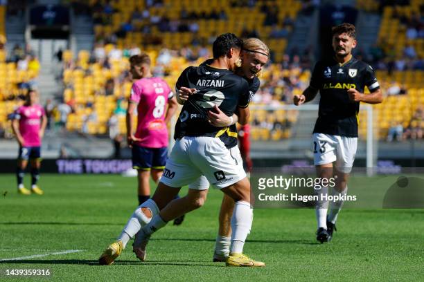 Lachlan Rose of Macarthur FC celebrates with Daniel Arzani after scoring a goal during the round five A-League Men's match between Wellington Phoenix...