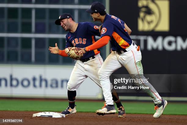 Jose Altuve and Jeremy Pena of the Houston Astros celebrate after defeating the Philadelphia Phillies 4-1 to win the 2022 World Series in Game Six of...