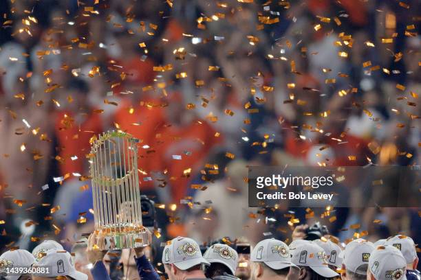 The commissioner's trophy is lifted as the Houston Astros defeat the Philadelphia Phillies 4-1 to win the 2022 World Series in Game Six of the 2022...