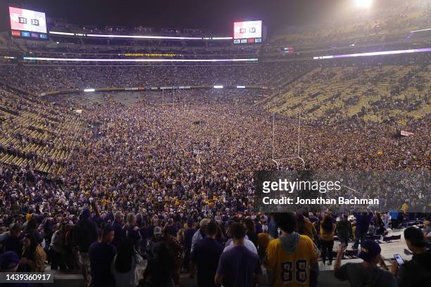 Fans storm the field to celebrates their win against the Alabama Crimson Tide at Tiger Stadium on November 05, 2022 in Baton Rouge, Louisiana.