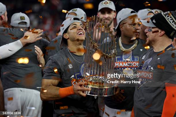 Jeremy Pena of the Houston Astros lifts the commissioner's trophy after defeating the Philadelphia Phillies 4-1 to win the 2022 World Series in Game...