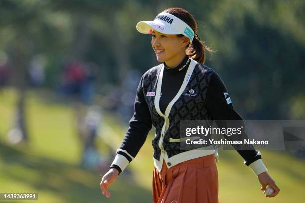 Kana Nagai of Japan smiles after the birdie on the 13th green during the final round of the TOTO Japan Classic at Seta Golf Course North Course on...